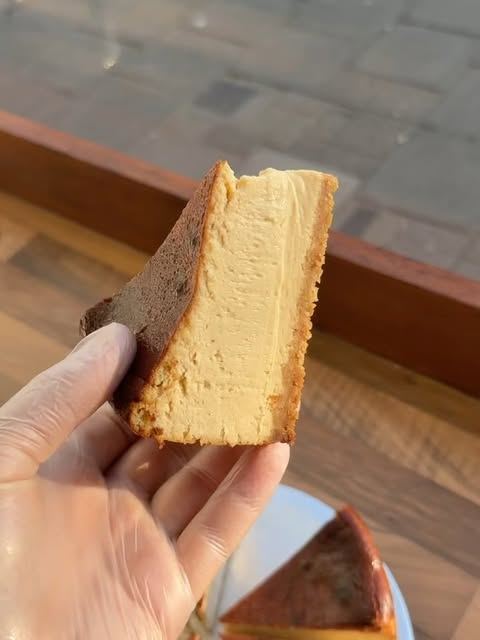 Slice of Basque cheesecake with a caramelised top