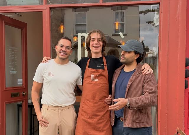 The Misù team outside the red shopfront at 54a Mill Road